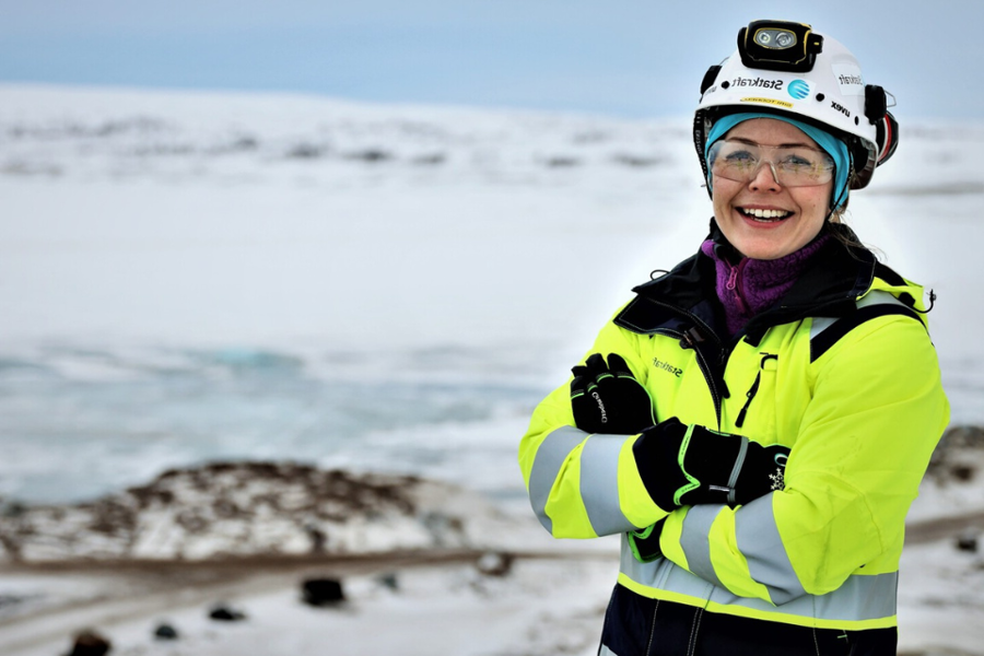 Woman wearing safety gear and smiling