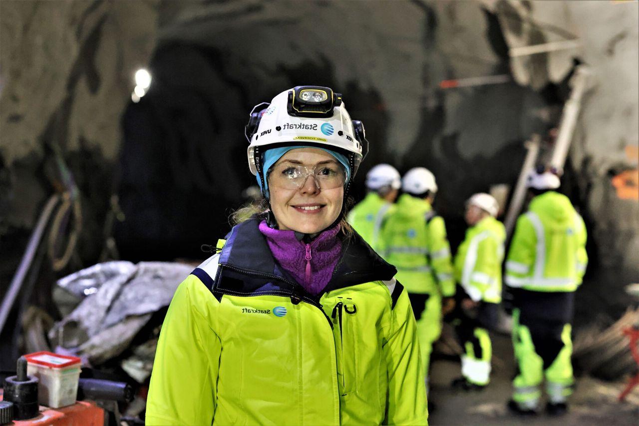 Woman wearing safety gear and smiling 